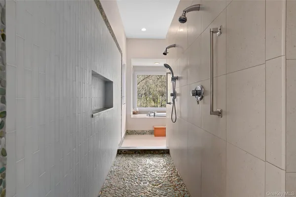 a bathroom with a glass door shower