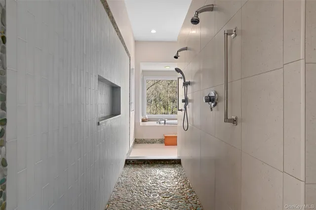 a bathroom with a glass door shower