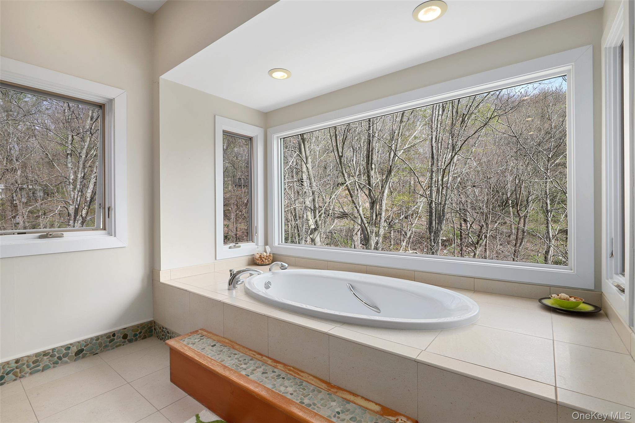 17 Fox Run Road Pound Ridge, NY 10576 - Photo 22 of 30 a bathroom with a bathtub and window