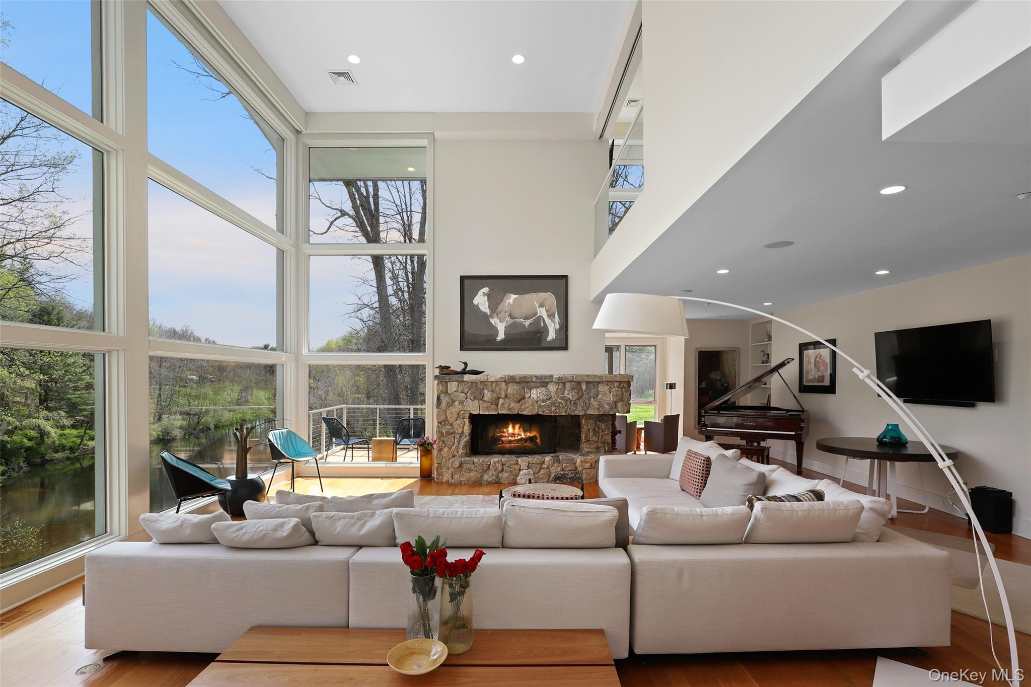 17 Fox Run Road Pound Ridge, NY 10576 - Photo 6 of 30 a living room with fireplace furniture and a large window