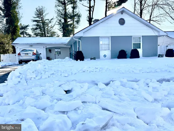 a view of a house with a yard and roof