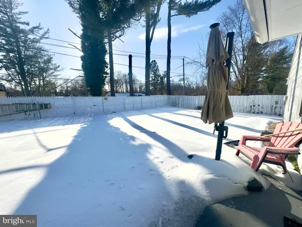 a view of a patio with a table and chairs