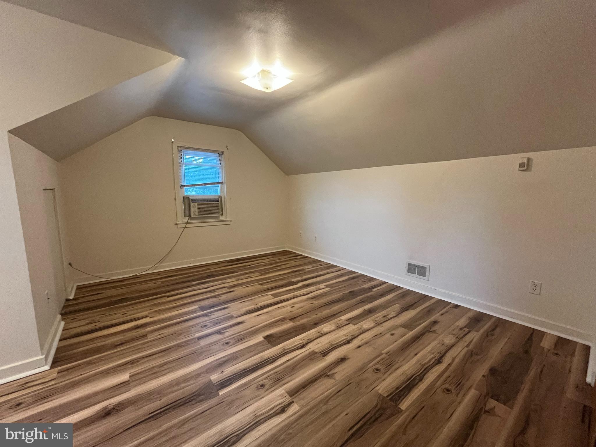 4113 Rosemont Avenue, Unit A Camp Hill, PA 17011 - Photo 5 of 10 a view of a room with wooden floor and staircase