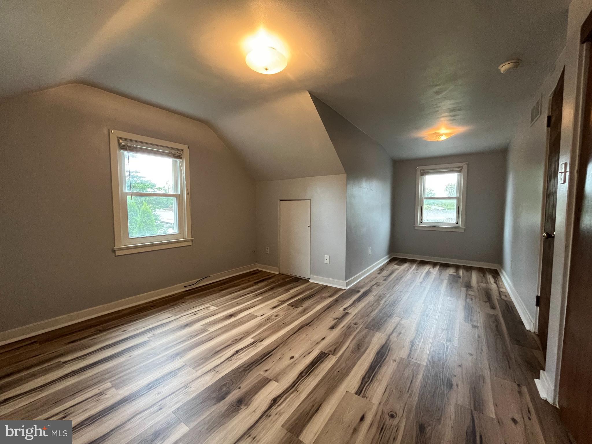 4113 Rosemont Avenue, Unit A Camp Hill, PA 17011 - Photo 9 of 10 a view of empty room with window and wooden floor