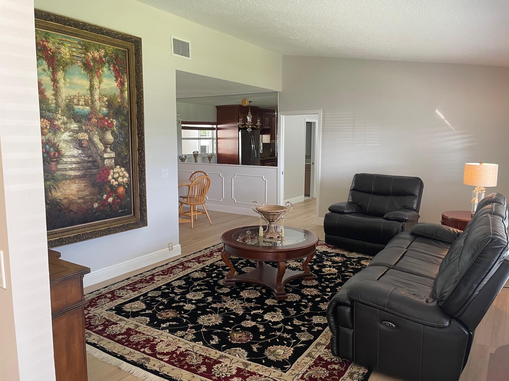 2601 West Carandis Road West Palm Beach, FL 33406 - Photo 2 of 13 a living room with furniture