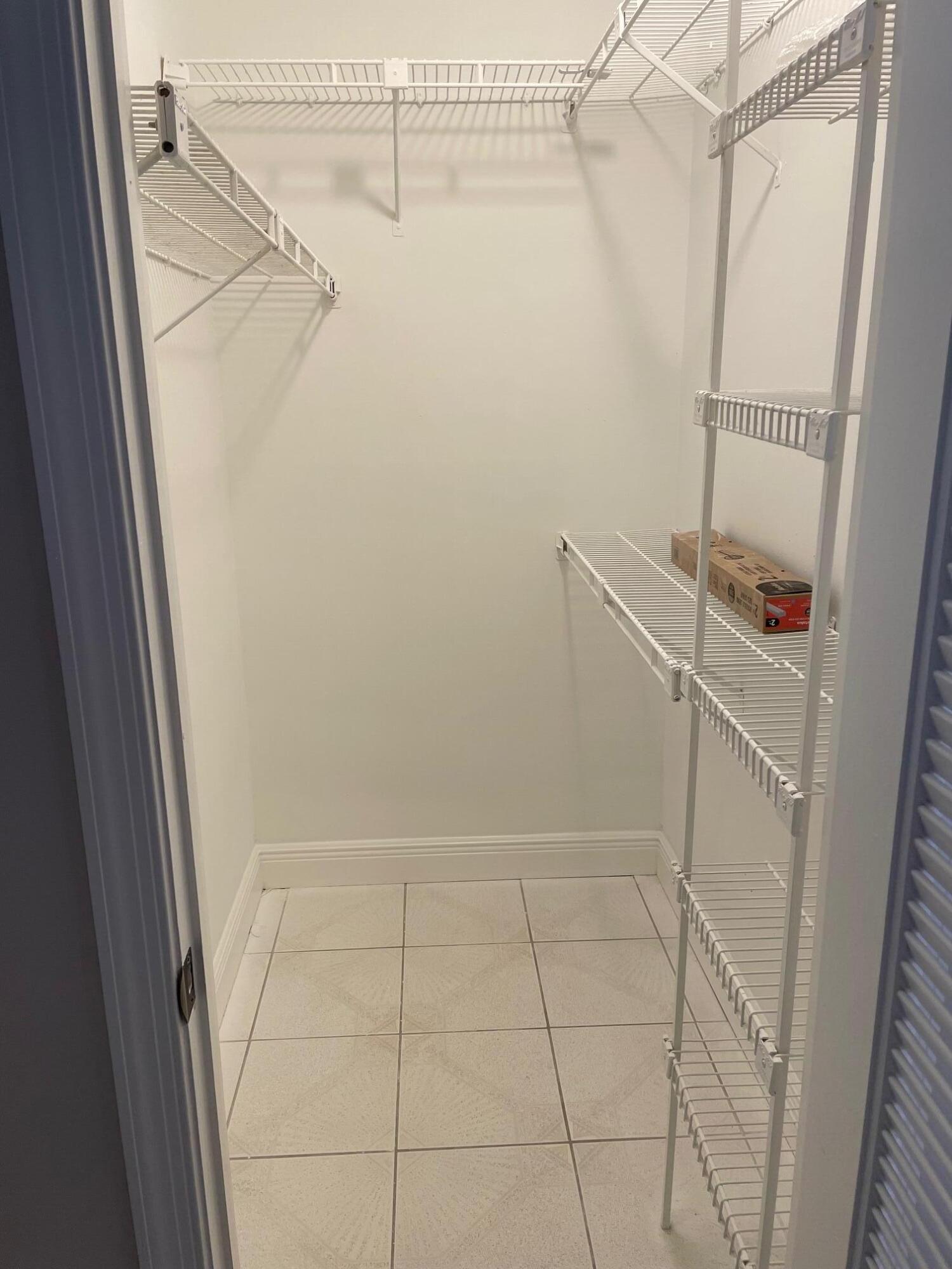 2601 West Carandis Road West Palm Beach, FL 33406 - Photo 4 of 13 a bathroom with a shower