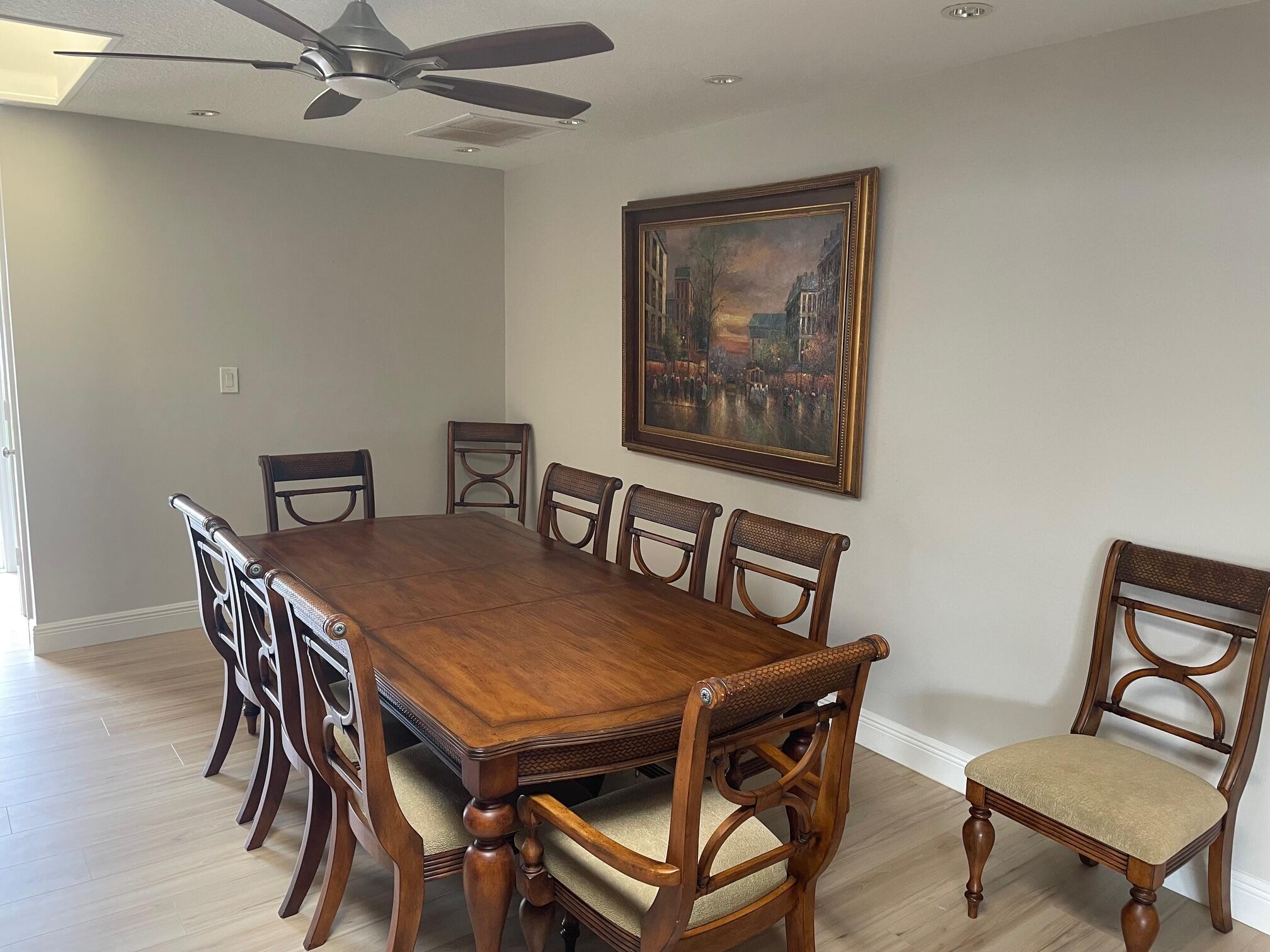 2601 West Carandis Road West Palm Beach, FL 33406 - Photo 6 of 13 a view of a dining room with furniture and a chandelier