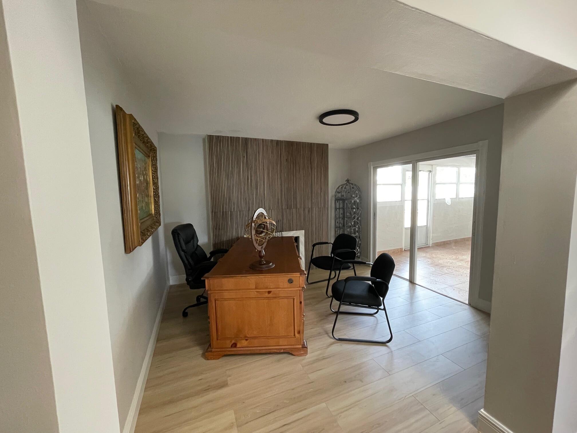 2601 West Carandis Road West Palm Beach, FL 33406 - Photo 7 of 13 a living room with furniture and a large window