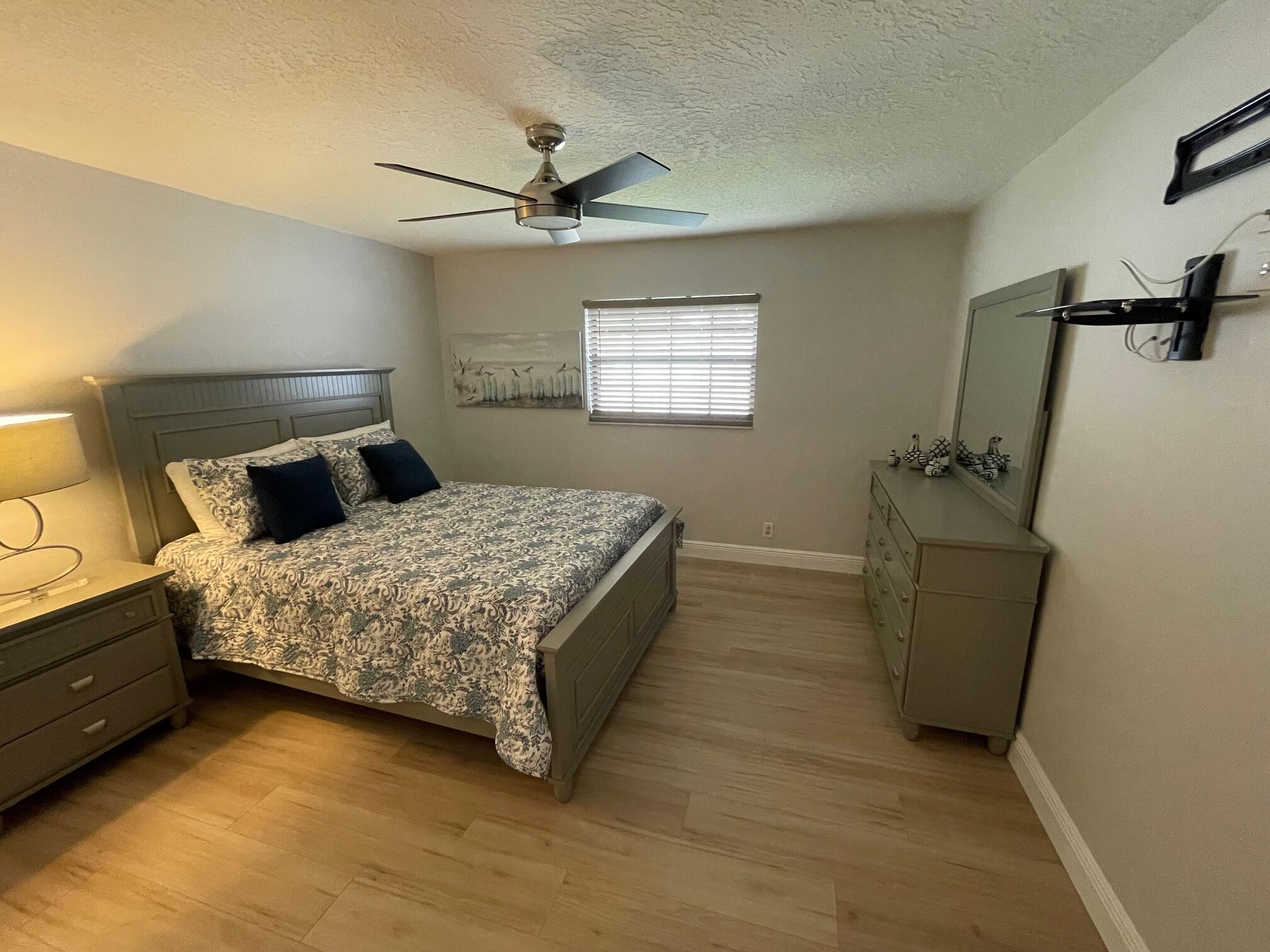 2601 West Carandis Road West Palm Beach, FL 33406 - Photo 8 of 13 a bedroom with a bed and a window