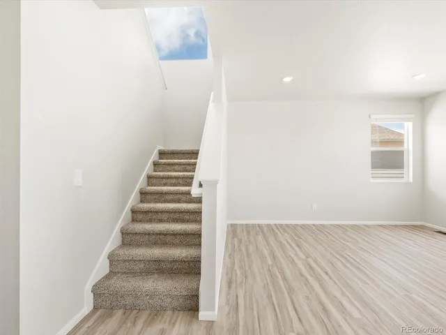 a view of entryway with wooden floor