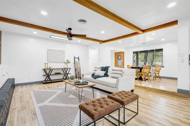 a kitchen with a sink a cabinets and wooden floor