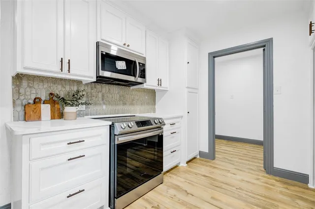 a bathroom with double vanity sink and mirror