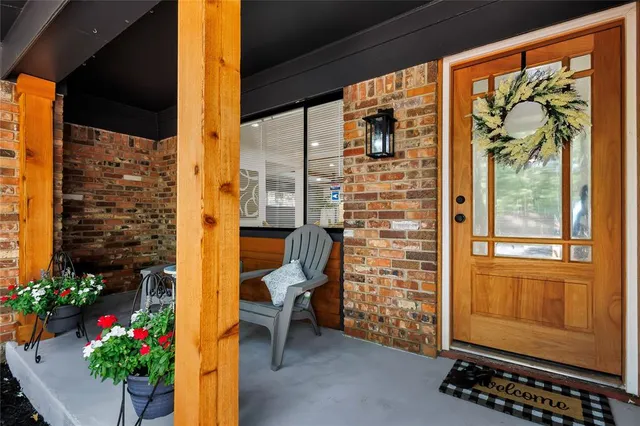 a backyard of a house with yard and outdoor seating