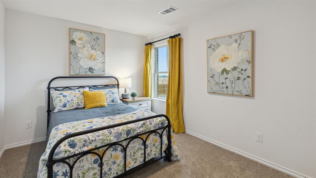 140 Pheasant Run Road Terrell, TX 75160 - Photo 22 of 26 Carpeted bedroom featuring a single window with curtain rod, white baseboards, and neutral wall paint