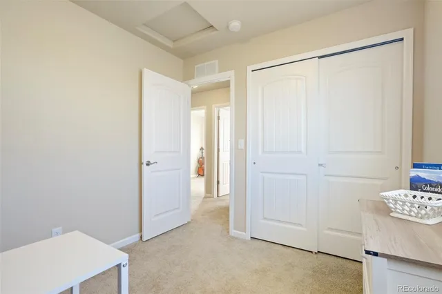 a view of a bedroom with closet