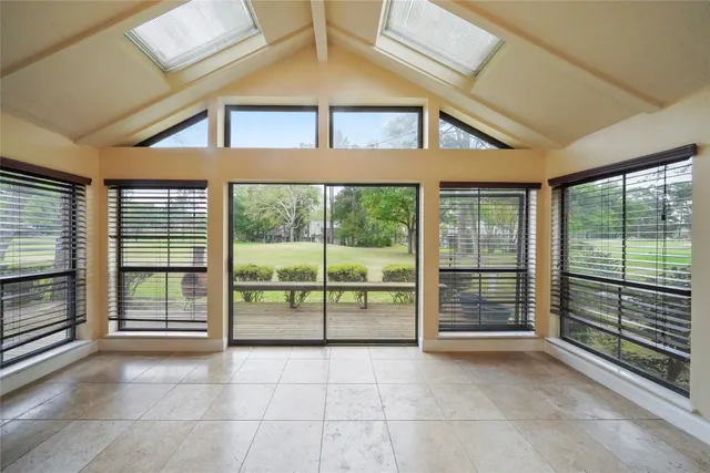 a view of an empty room with a balcony