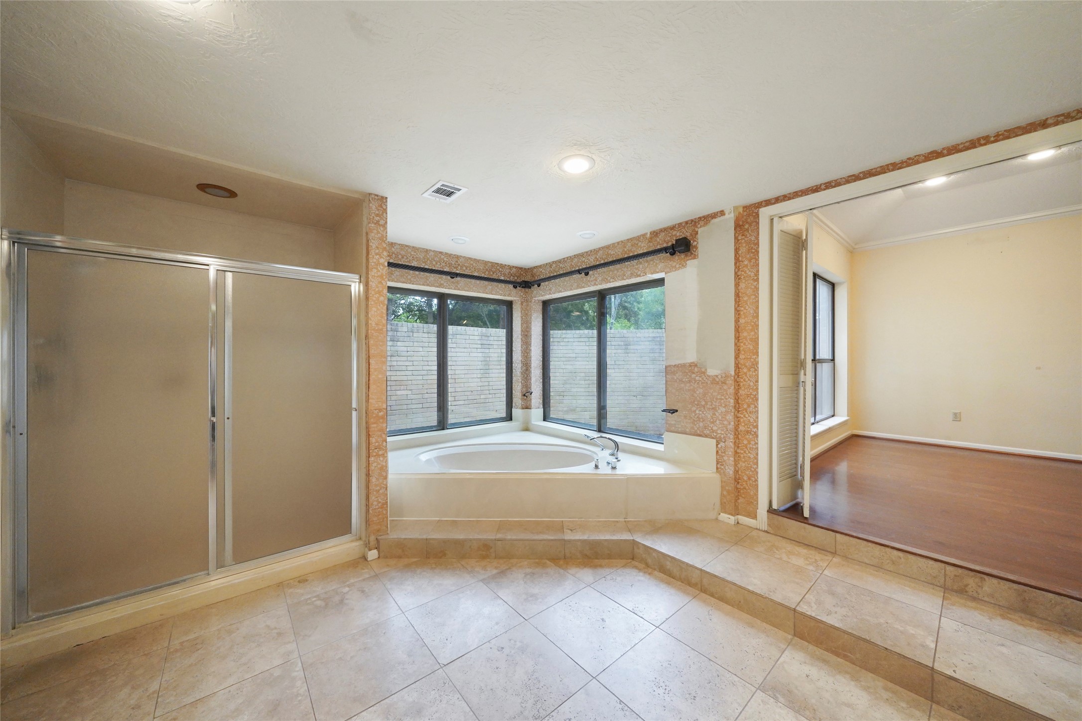 84 April Wind Drive South Conroe, TX 77356 - Photo 23 of 36 a view of an empty room with wooden floor and a window