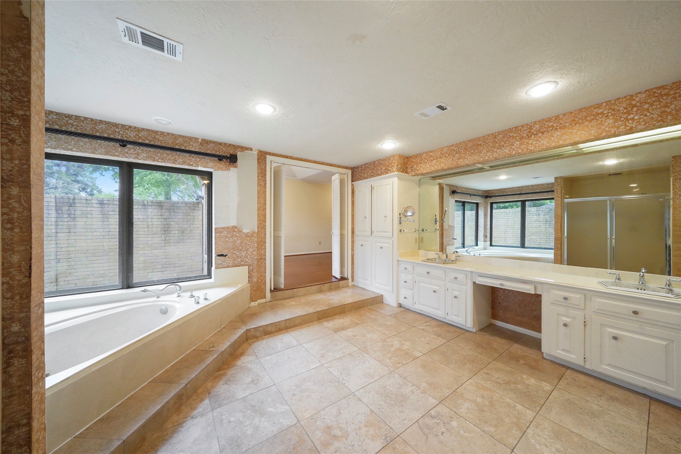 84 April Wind Drive South Conroe, TX 77356 - Photo 24 of 36 a large spacious bathroom with a large tub and shower