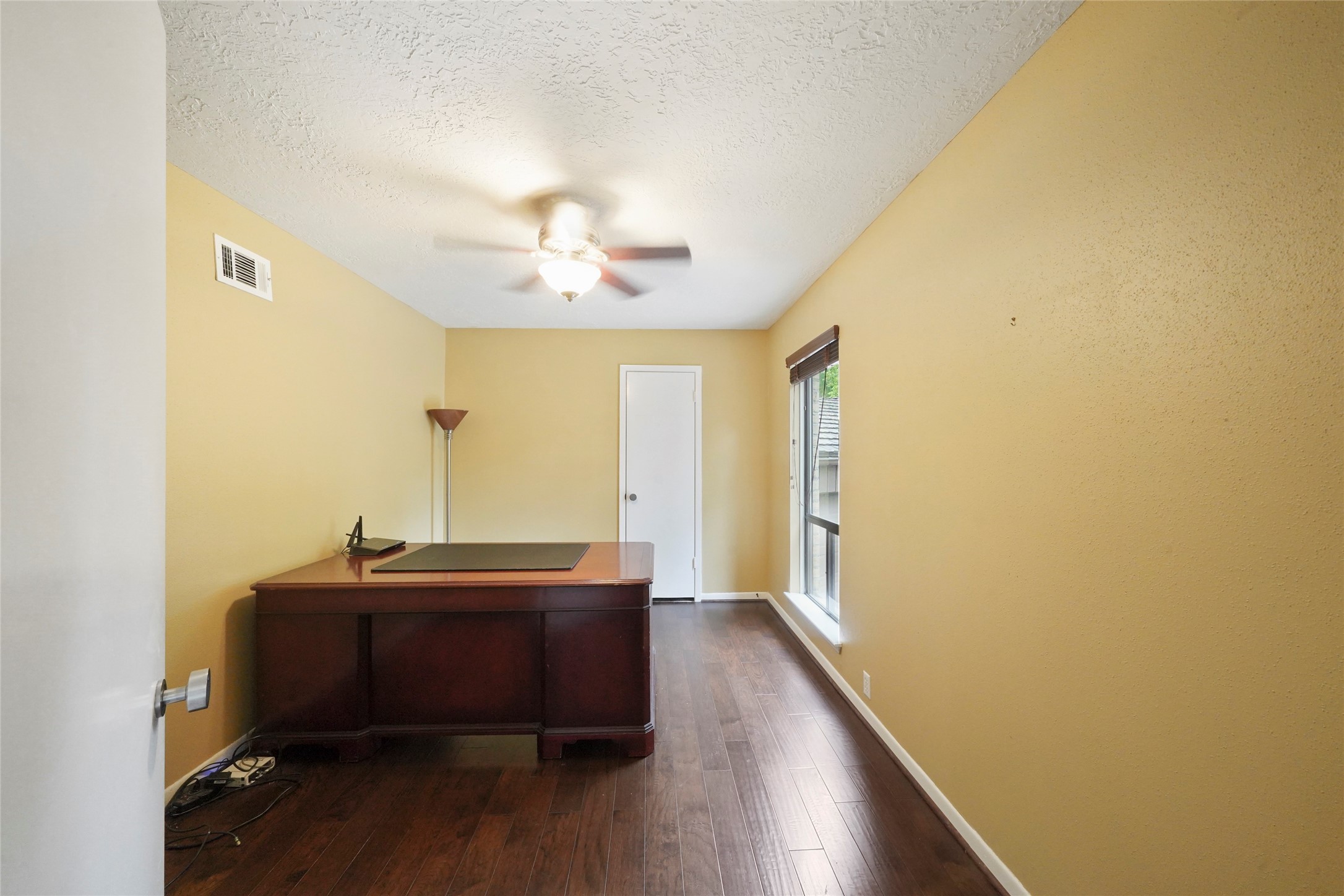 84 April Wind Drive South Conroe, TX 77356 - Photo 28 of 36 a view of room with a large window and wooden floor