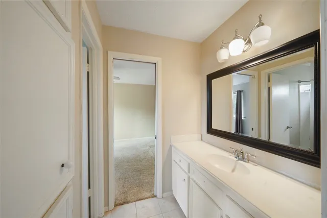 a bathroom with a bathtub a sink and a mirror