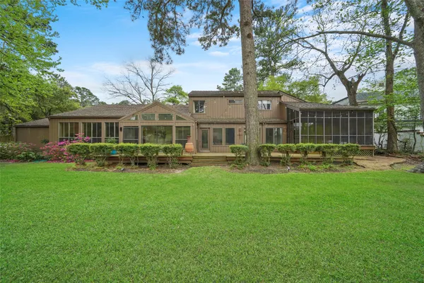 a front view of a house with a yard table and chairs