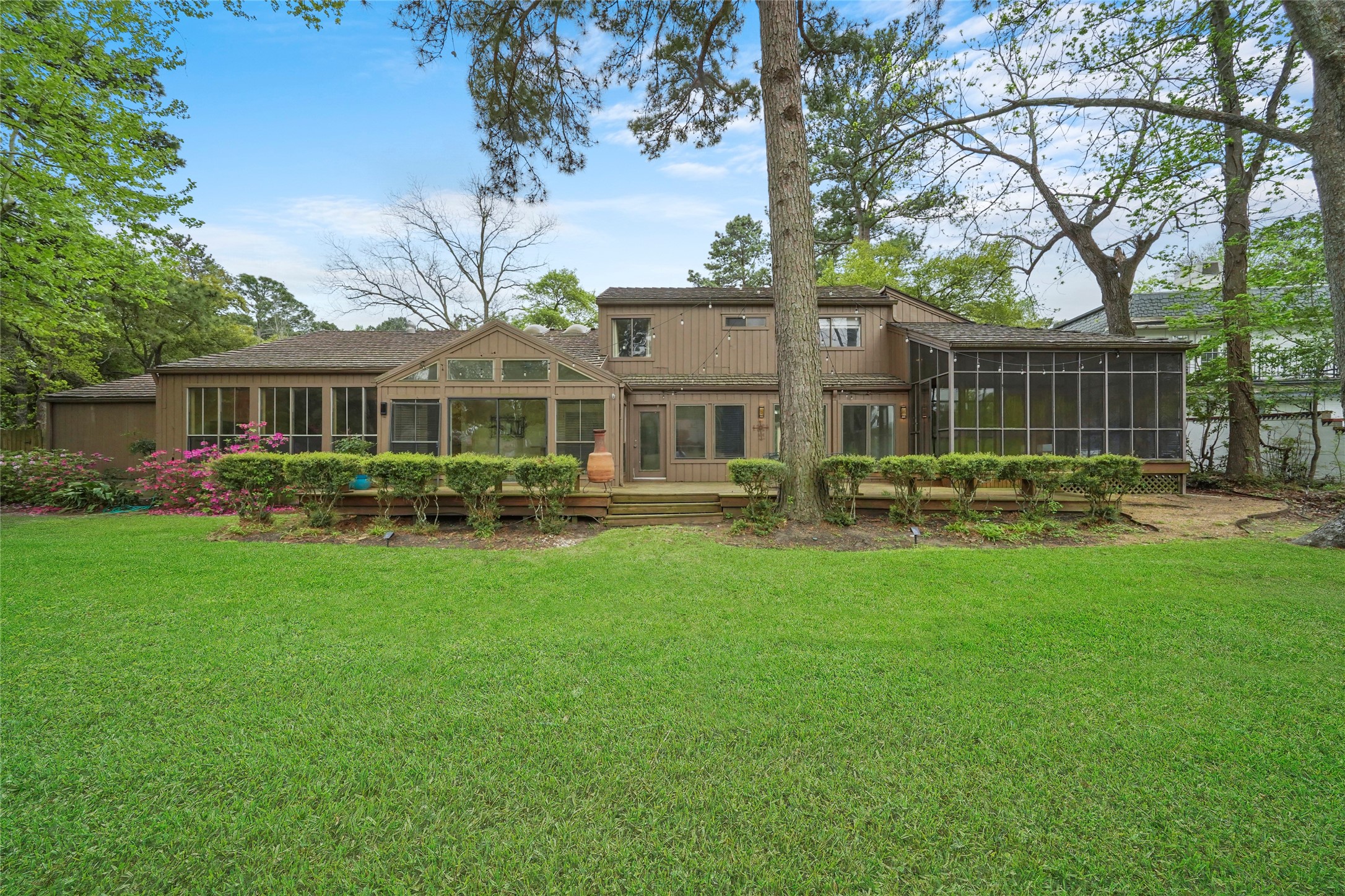 84 April Wind Drive South Conroe, TX 77356 - Photo 3 of 36 a front view of a house with a yard table and chairs