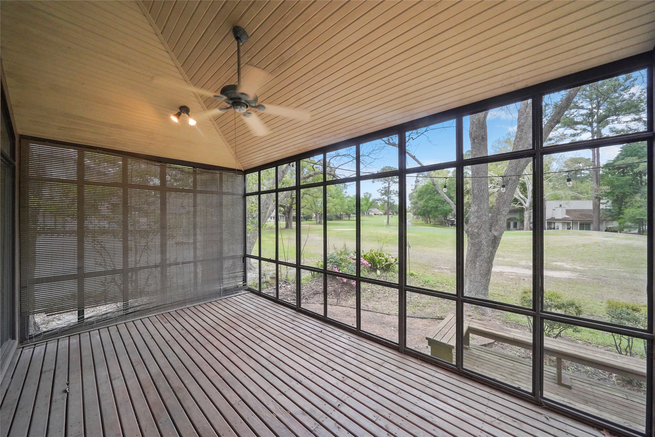 84 April Wind Drive South Conroe, TX 77356 - Photo 4 of 36 a view of a porch with wooden floor