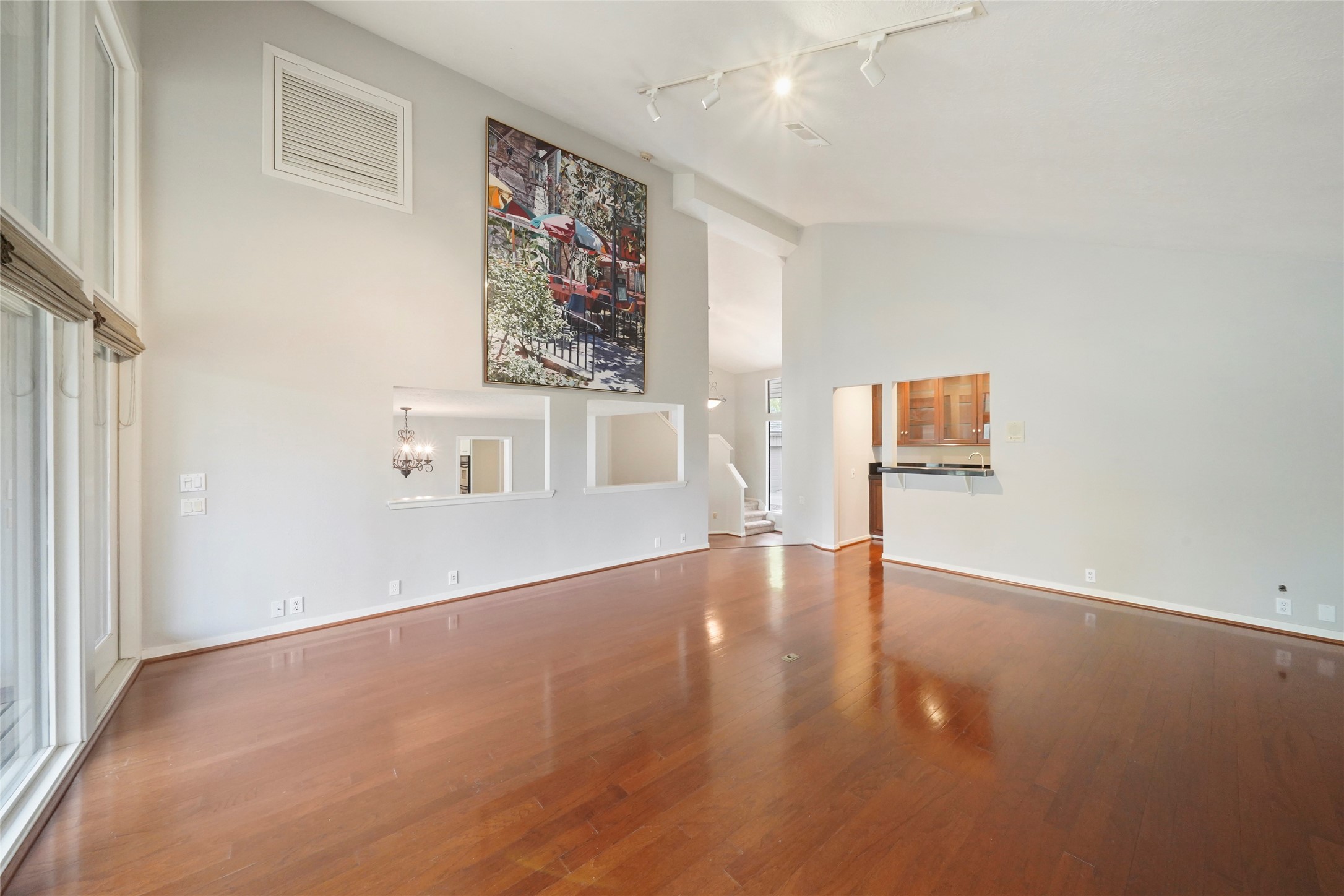 84 April Wind Drive South Conroe, TX 77356 - Photo 10 of 36 an empty room with windows and cabinet