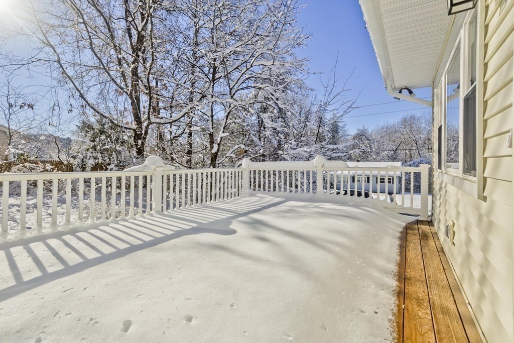 46 Glenn Street Three Rivers, MA 01080 - Photo 3 of 37 a view of a balcony with wooden floor and fence