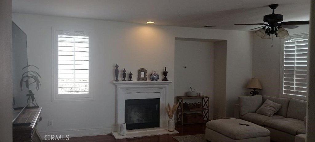 28799 First Star Court Menifee, CA 92584 - Photo 13 of 19 a living room with furniture and a fireplace
