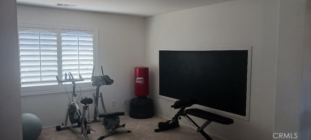 28799 First Star Court Menifee, CA 92584 - Photo 17 of 19 a view of a workspace with furniture and a window