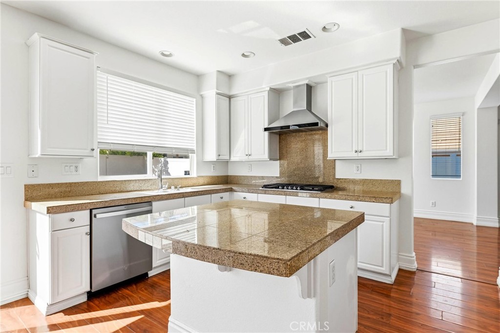 28799 First Star Court Menifee, CA 92584 - Photo 21 of 70 a kitchen with a sink stove and cabinets