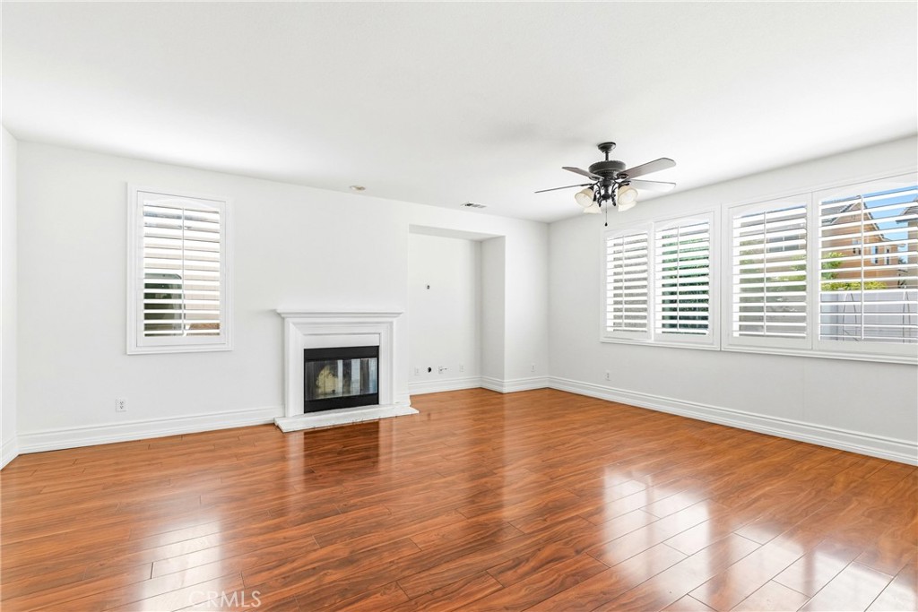 28799 First Star Court Menifee, CA 92584 - Photo 25 of 70 an empty room with windows and a fireplace