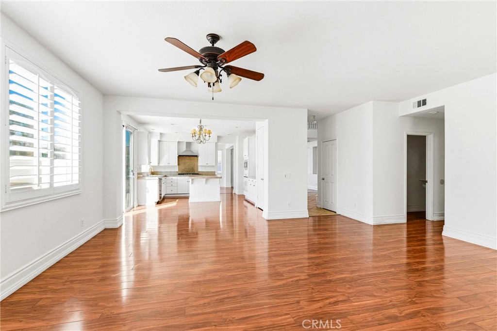 28799 First Star Court Menifee, CA 92584 - Photo 27 of 70 a view of empty room with wooden floor and window