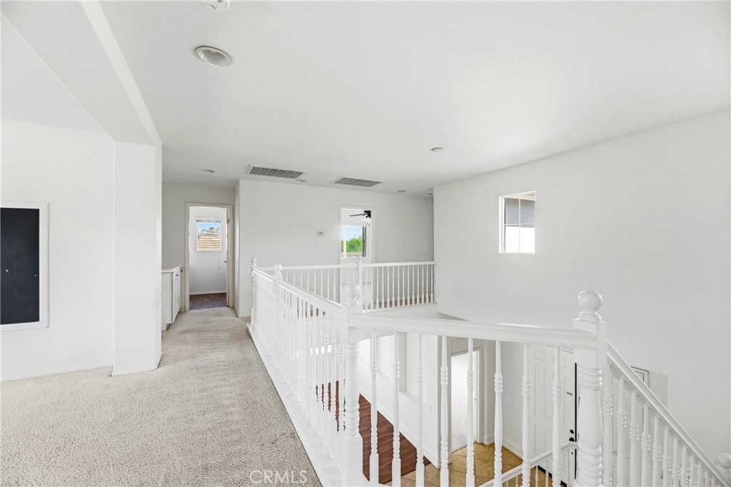 28799 First Star Court Menifee, CA 92584 - Photo 42 of 70 a view of a hallway with windows