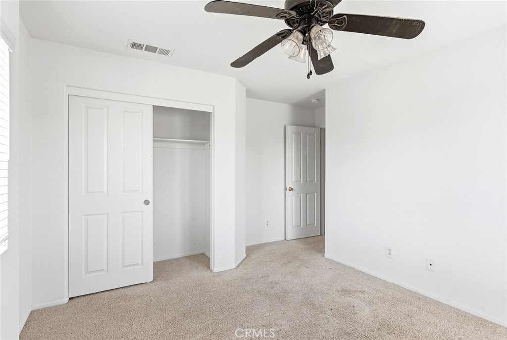 28799 First Star Court Menifee, CA 92584 - Photo 51 of 70 an empty room with chandelier fan