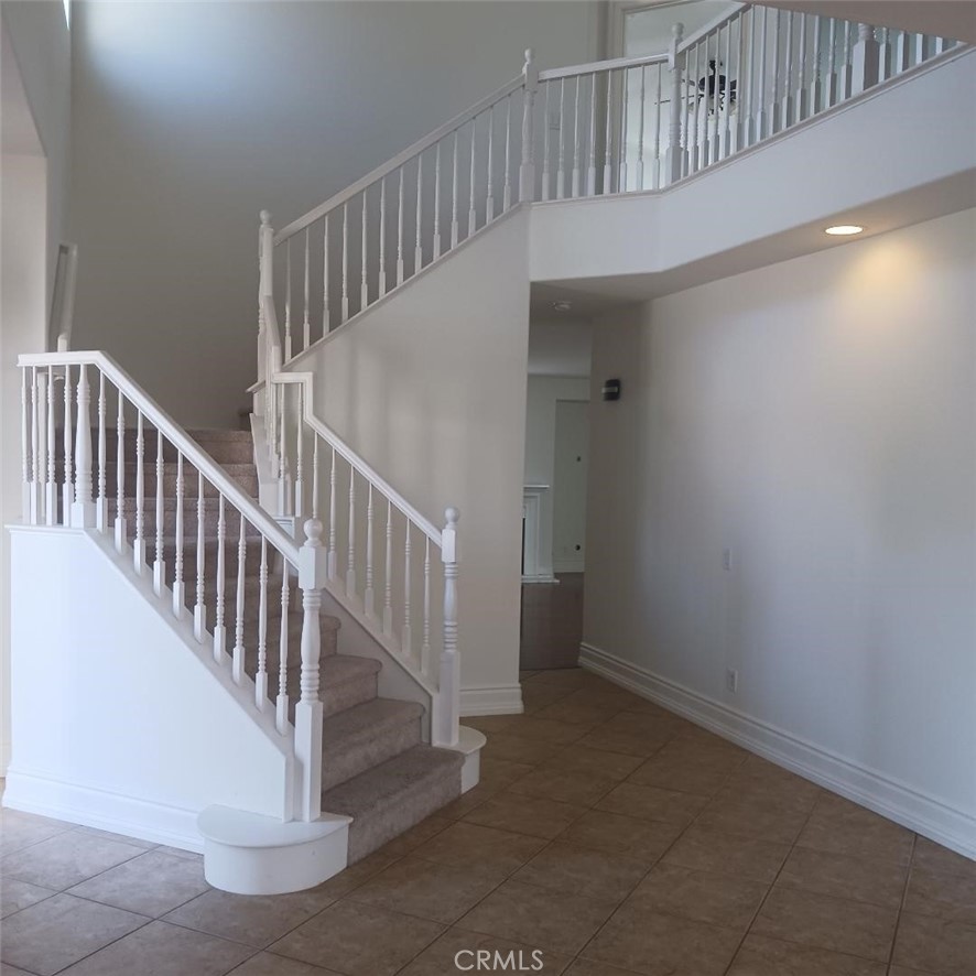 28799 First Star Court Menifee, CA 92584 - Photo 6 of 19 a view of staircase with white walls and a window