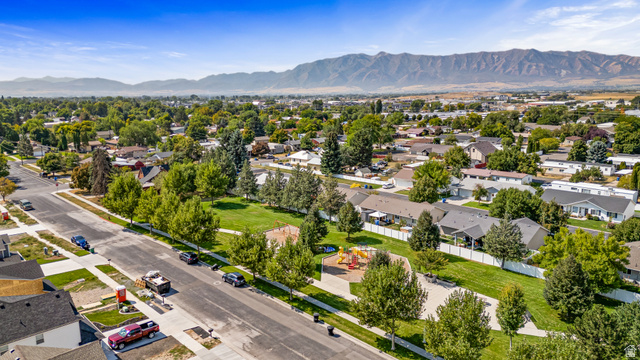 612 North 400 West Logan, UT 84321 - Photo 8 of 27 Expansive residential area with a prominent public park, mature trees, and mountain backdrop