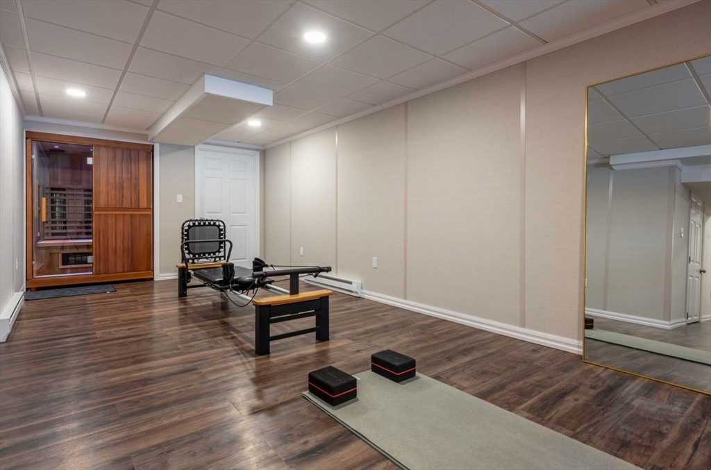 5 John West Road Exeter, NH 03833 - Photo 22 of 33 a living room with furniture and wooden floor