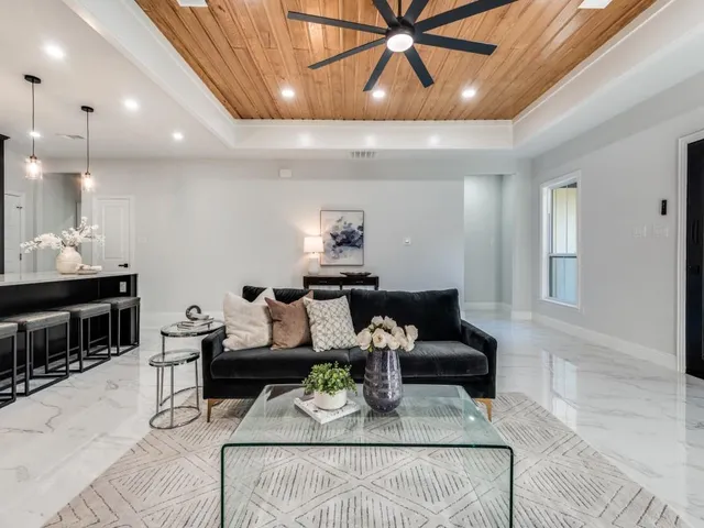 a living room with furniture and a table