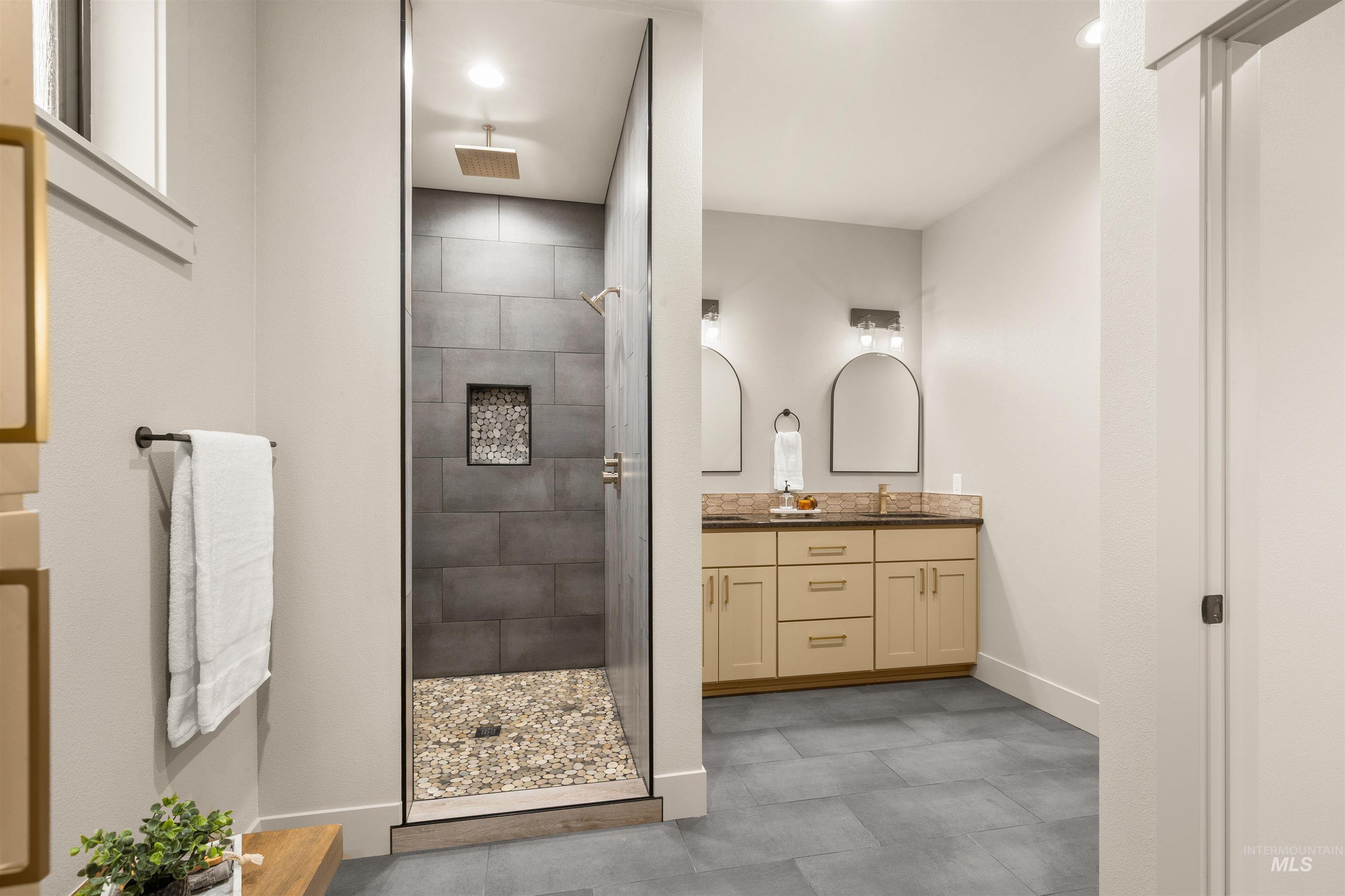 335 Warner Avenue Lewiston, ID 83501 - Photo 26 of 43 Bathroom featuring double vanity and a stall shower