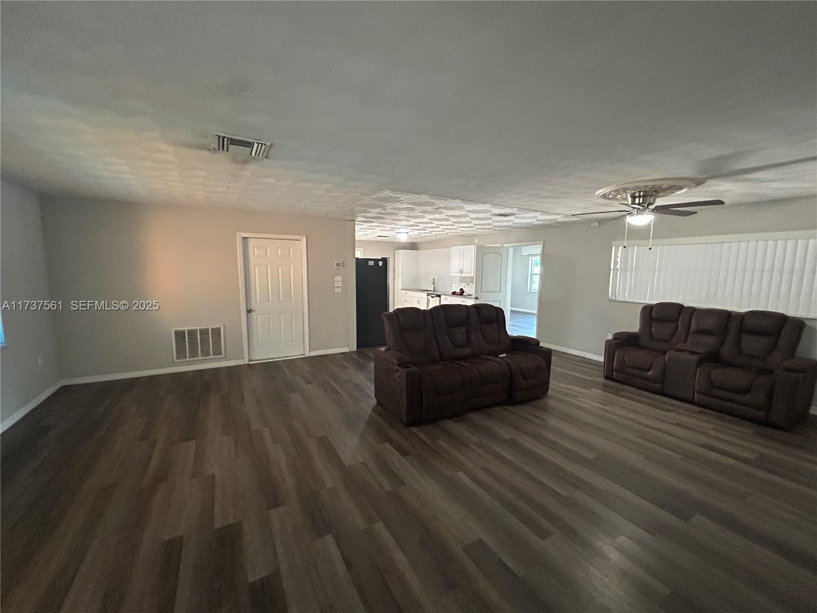 7403 Foxbloom Drive Port Richey, FL 34668 - Photo 20 of 45 a living room with furniture and a wooden floor