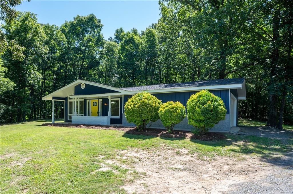 355 Lovebridge Road Southeast Calhoun, GA 30701 - Photo 1 of 1 a front view of a house with garden