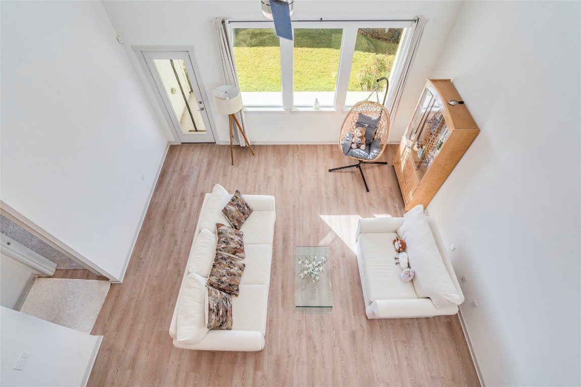 10932 Defender Trail Austin, TX 78754 - Photo 12 of 35 a view of front door with furniture and wooden floor