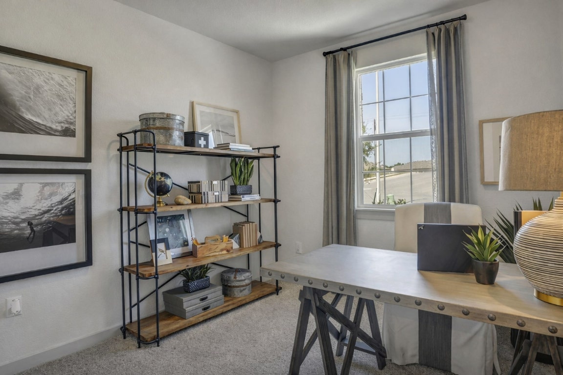 10932 Defender Trail Austin, TX 78754 - Photo 13 of 35 a view of a workspace with furniture and a window