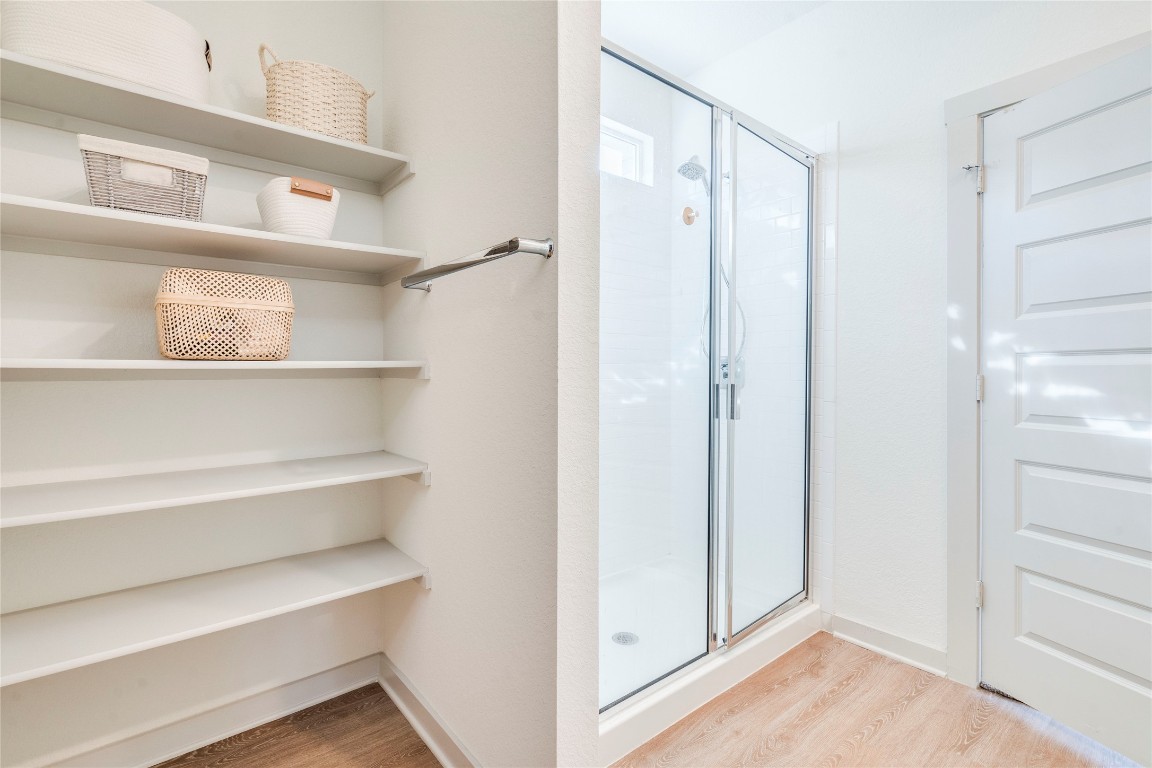 10932 Defender Trail Austin, TX 78754 - Photo 19 of 35 a view of walk in closet with empty racks