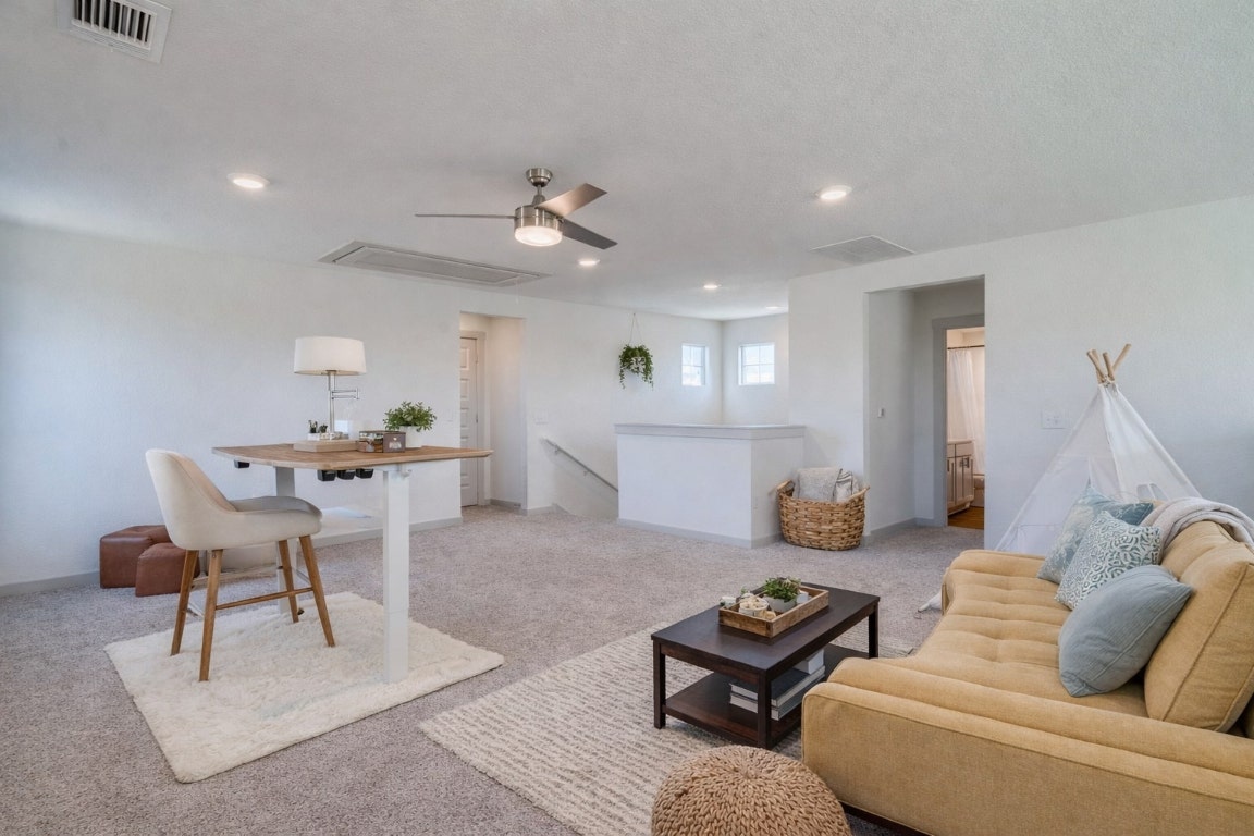 10932 Defender Trail Austin, TX 78754 - Photo 23 of 35 a living room with furniture and a wooden floor