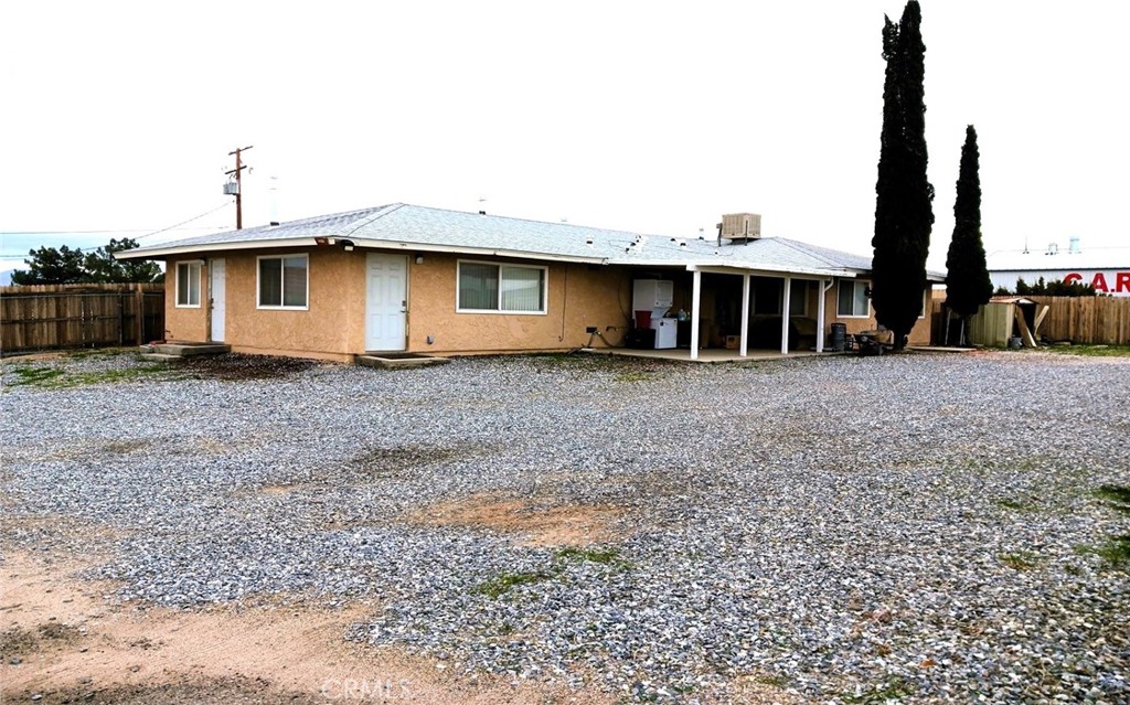 14333 Main Street Hesperia, CA 92345 - Photo 2 of 6 a front view of a house with a yard