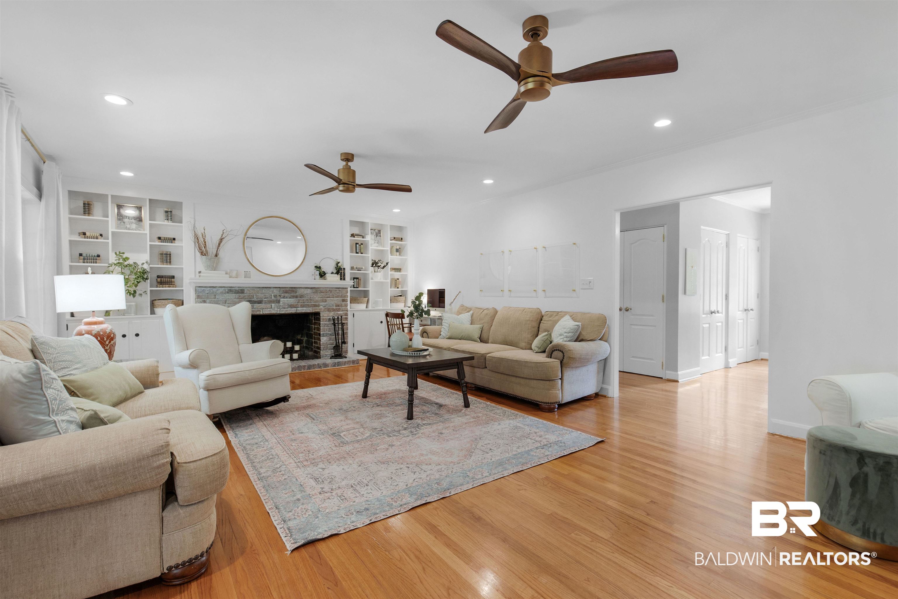 4306 Michael Boulevard Mobile, AL 36609 - Photo 11 of 35 Living room with ceiling fan, light hardwood / wood-style flooring, and built in features