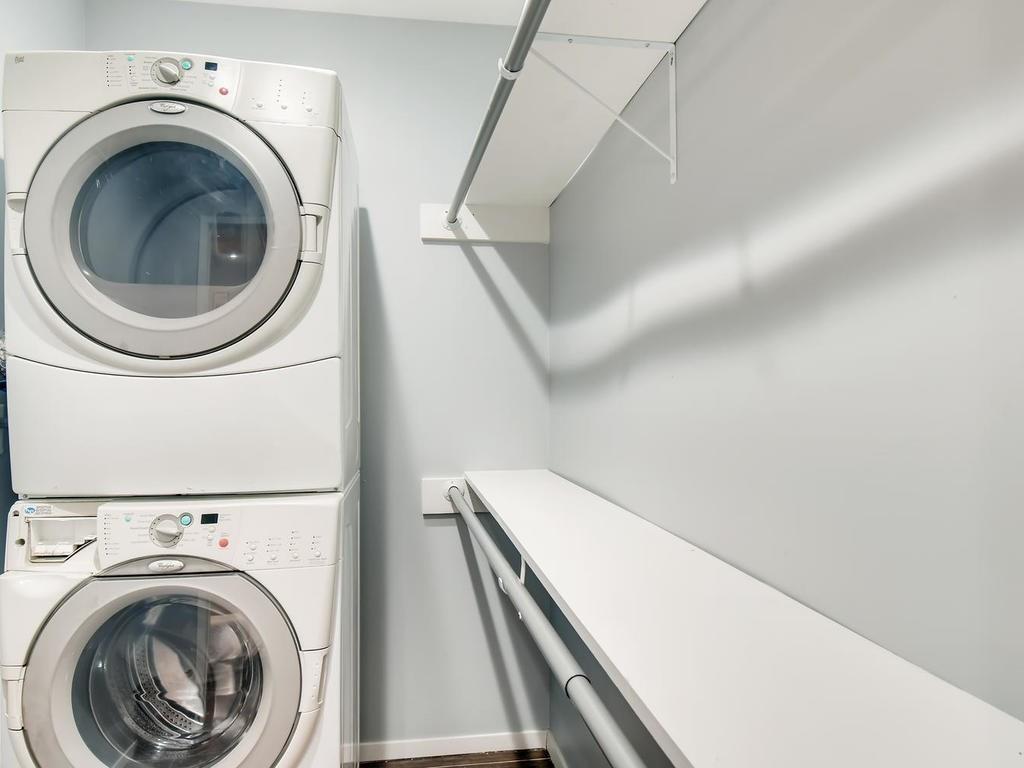 910 Duncan Lane, Unit 16 Austin, TX 78705 - Photo 12 of 15 a view of a hallway with washer and dryer